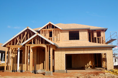 Image of a new house construction that has been framed.